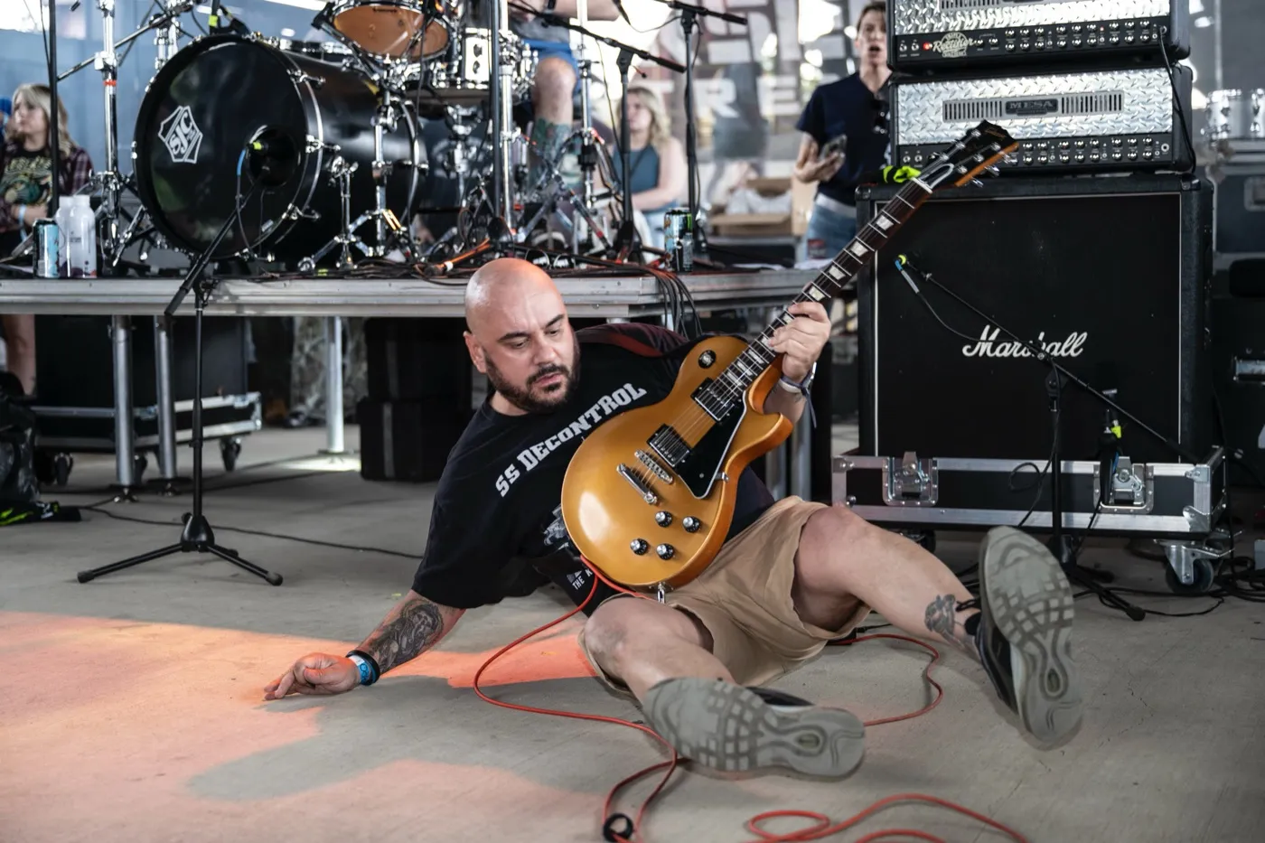 John LaCroix on the stage floor with a Les Paul at Furnace Fest 2025