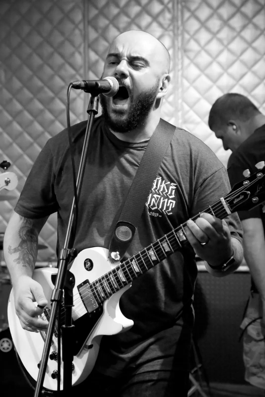 John LaCroix singing and playing a Les Paul on stage with Ten Yard Fight